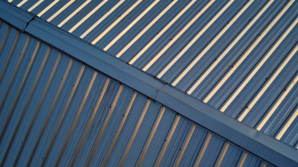 Blue corrugated metal roof with cream-colored stripes.